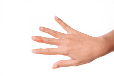 Close-up of human hand against white background