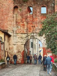 Group of people walking on building