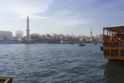 View of sea and buildings against sky