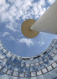 Low angle view of building against cloudy sky
