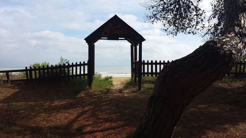 Built structure on field against sky