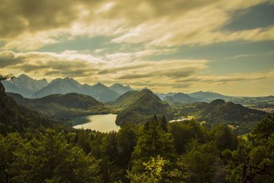 Scenic view of mountains against cloudy sky