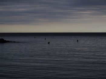 Scenic view of sea against sky at sunset