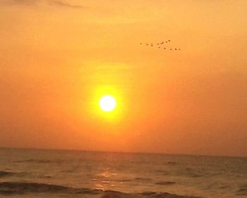 Scenic view of sea against sky at sunset