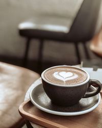 Close-up of coffee cup on table