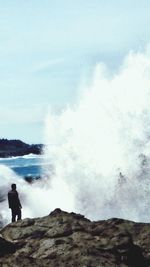Silhouette of woman standing on beach