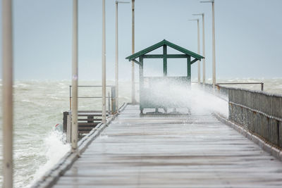 Pier against sky during winter