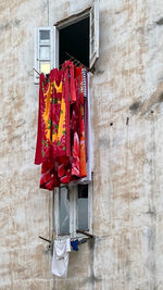 Clothes drying on wall against building