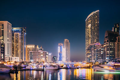 Illuminated buildings in city at night