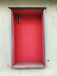 Red closed door of building