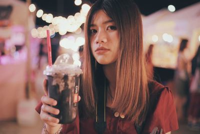 Portrait of woman holding ice cream