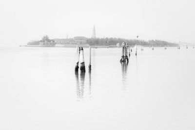 View of boats in lake against sky