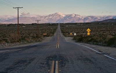 Country road leading towards mountains