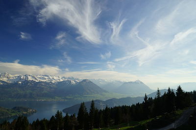 Panoramic view of trees and mountains against sky