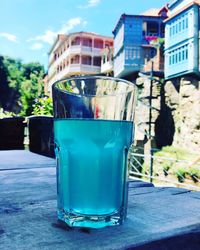 Close-up of drink against built structure