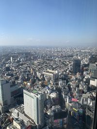 High angle view of modern buildings against clear sky