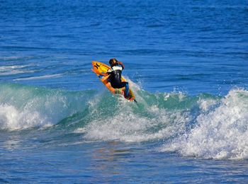 People surfing in sea