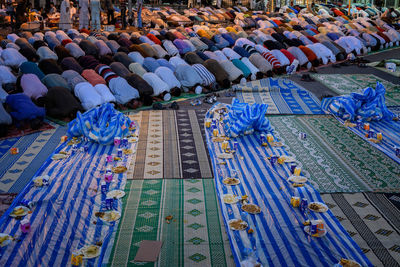 Islamic men bending while praying