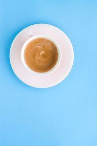 Directly above shot of coffee on blue background