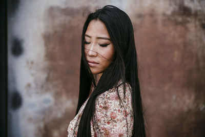 Portrait of woman standing outdoors