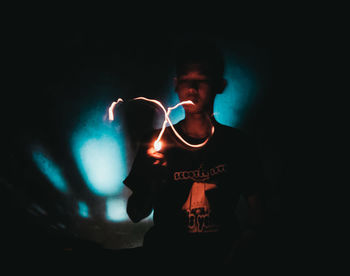 Young man with light painting