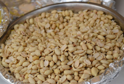 High angle view of peanuts in container