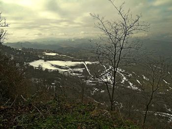 Scenic view of river against sky during winter