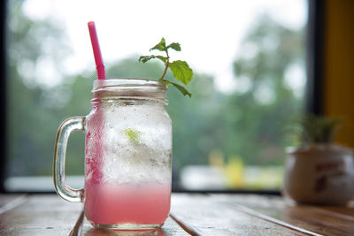 Close-up of drink in mason jar on table