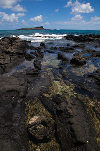 Scenic view of beach against sky