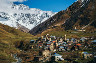 People on mountain against sky