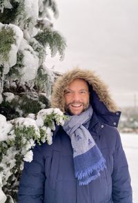 Portrait of smiling men in snow