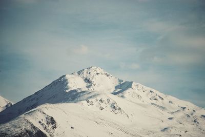 Scenic view of snowcapped mountain against sky