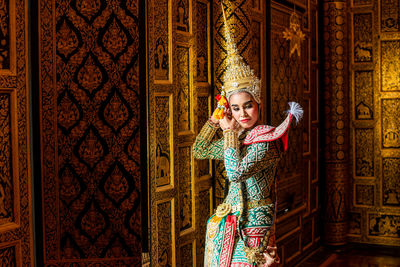 Young woman in costume at temple