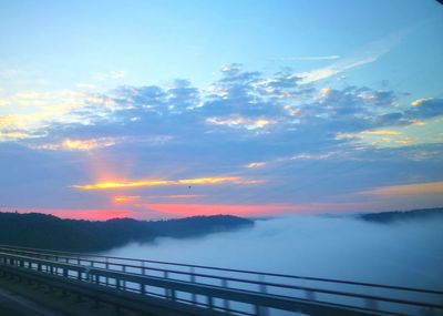 Scenic view of bridge against sky during sunset