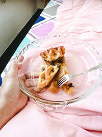 Midsection of person holding ice cream in plate