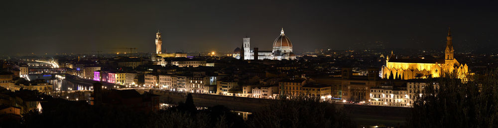 High angle view of illuminated buildings in city at night