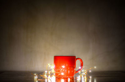 Red wine on table against wall
