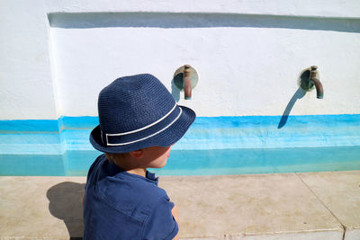 Boy wearing blue hat during sunny day