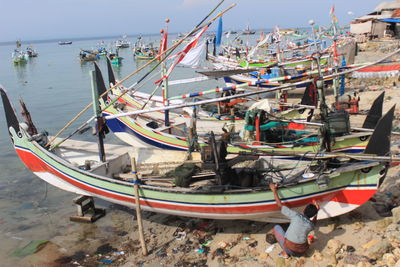 High angle view of fishing boats moored at harbor