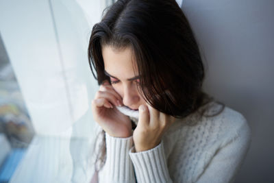 Close-up of young woman looking away