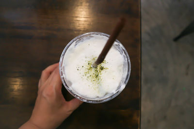 Close-up of hand holding ice cream