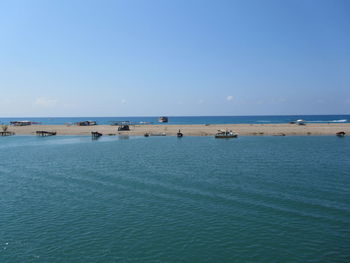 Scenic view of sea against clear blue sky