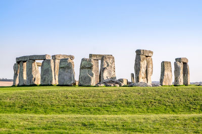 Built structure on field against clear sky