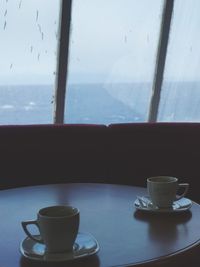 Close-up of coffee cup on table