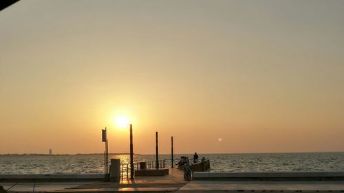 Scenic view of sea against clear sky during sunset