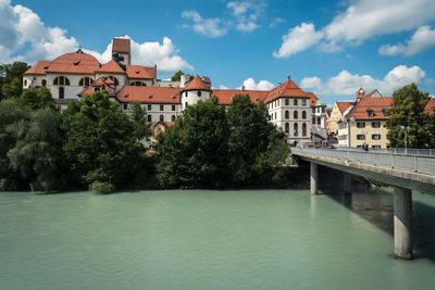 High castle of füssen and bridge over lech river in old town of fussen, bavaria, germany