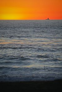 Scenic view of sea against dramatic sky