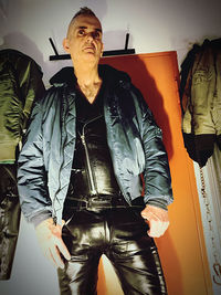 Portrait of man standing with umbrella