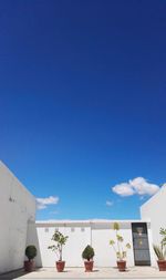 View of built structures against blue sky