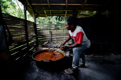 Full length of man preparing food